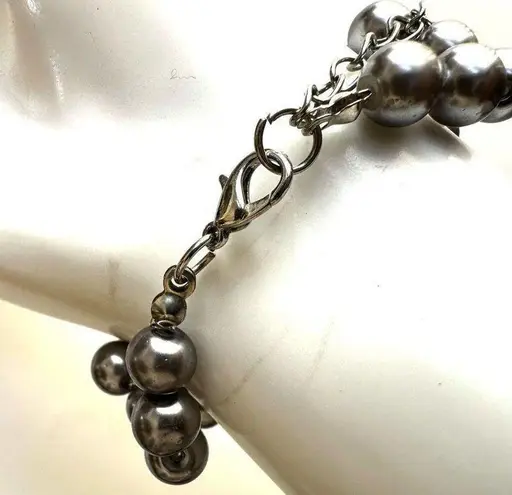 Grey faux pearl and black beaded bracelet Gray