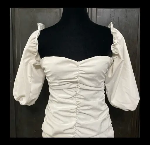 White dress with attached short Puffy sleeves