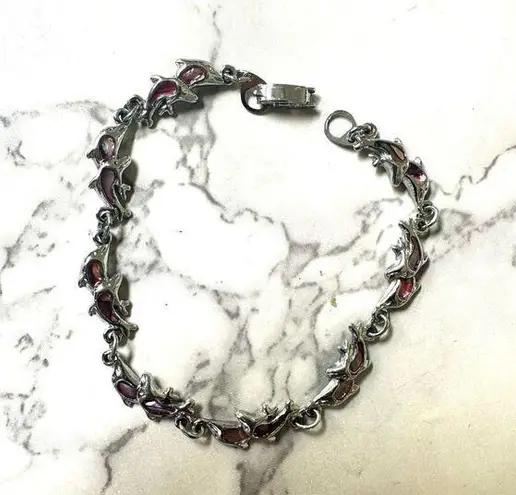 Silver tone dolphin pink abalone bracelet