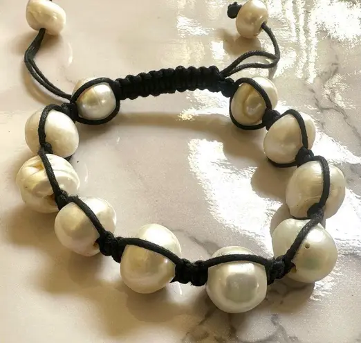 Pearl bracelet on adjustable black silk cord