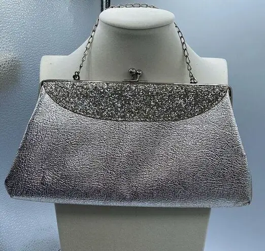 Vintage mid century silver foil clutch with silver cut stones .