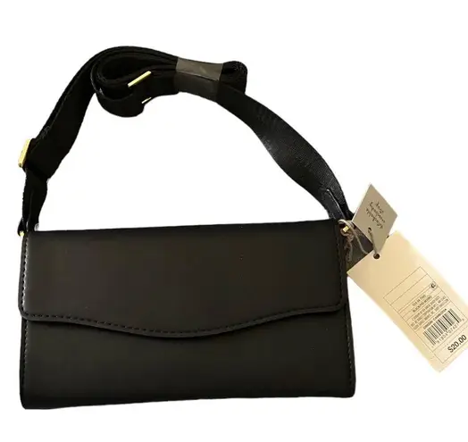 A New Day NWT-  Black crossbody bag  Faux Leather Adjustable crossbody strap Removable crossbody strap Magnetic closure  Inside: zip pocket, credit card pocket and cell phone pocket  Measures: 4.25x7.75x1.25 inches