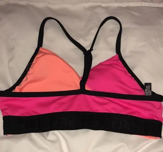 PINK - Victoria's Secret PINK Sport swim suit bikini top orange and pink in color size small spor…​