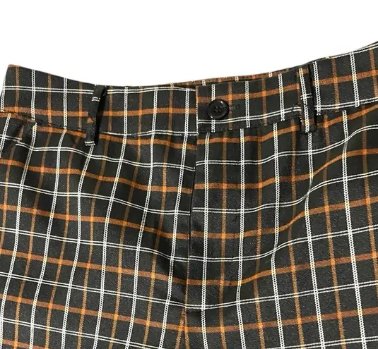 Full Tilt  cute fall look black slacks with orangish tan and white plaid.