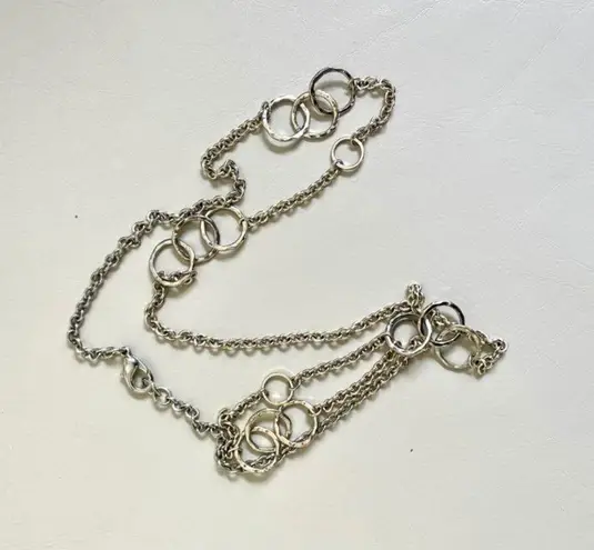 Long silver tone necklace with circles