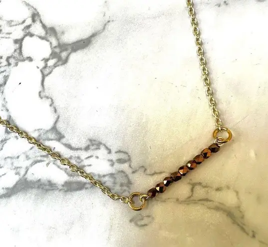 The Bar Gold tone copper bead necklace