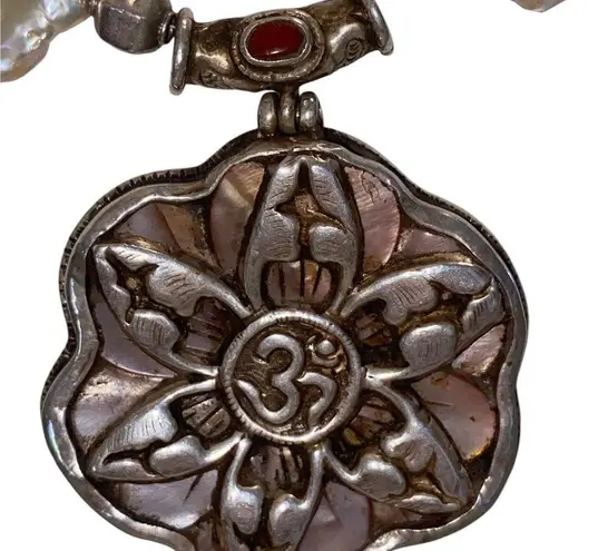 Keshi pearl & sacred OM mandala w/ unique charms along the string of pearls