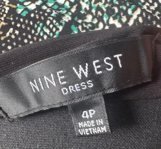 Nine West Snakeskin print fitted dress with a V-neckline and buckle details at the waist.