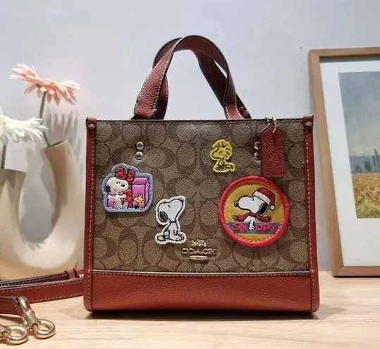 Coach  X Peanuts Dempsey Tote 22 In Signature Canvas With Patches CE851