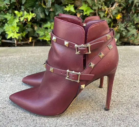 Valentino Garavani Valentino Rockstud pointy toe harness ankle boot in wine calfskin leather IT 36