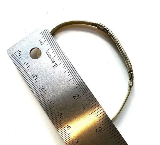 Gold tone etched open cuff bracelet