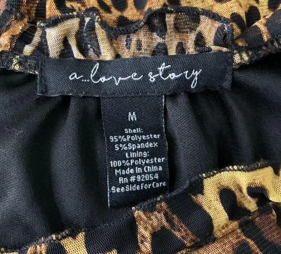 A Love Story Short Sleeve Peplum Top M Leopard Print Stretch Knit Lined Keyhole Size M