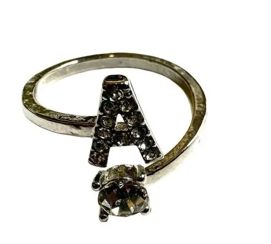 A monogram rhinestone ring Silver
