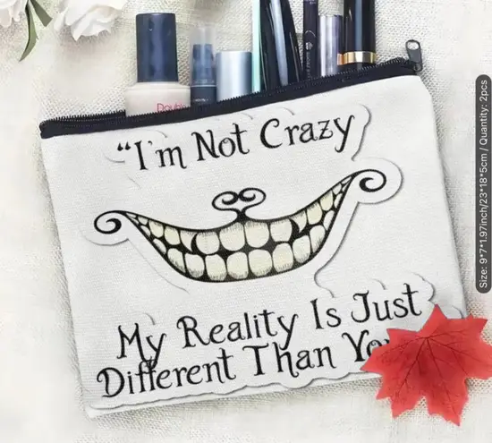 Afun attitude makeup bag with the words "I'm not crazy, my reality is different White