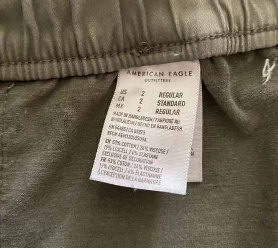 American Eagle -ARMY GREEN JOGGER PANTS-SIZE 2 Elastic waist with drawstring, zip front, two front and two back pockets, elastic ankles with a side zipper, excellent condition  Measurements: Waist: side to side 13-16 inches  Rise: 9 inches  Inseam: 37 inches