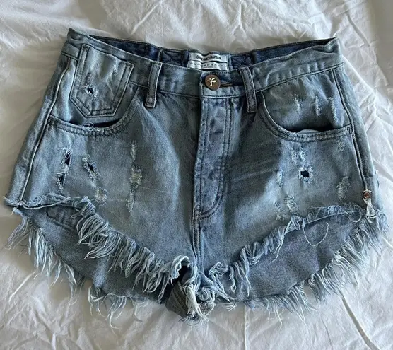 One Teaspoon  Light blue denim shorts with distressing and shredding Size 25