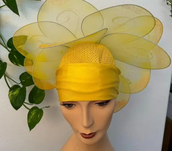 Handmade yellow floral hat. This hat was made for the stage in the theater.