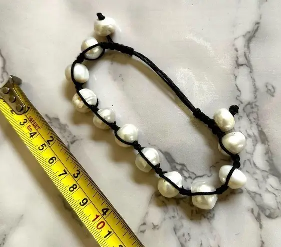 Pearl bracelet on adjustable black silk cord