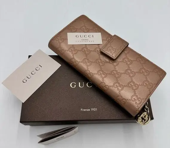 Gucci 
Metallic Guccissima Continental
Wallet Pink