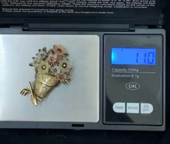 LIA Signed Pot of Flowers with Garden Tools Gold