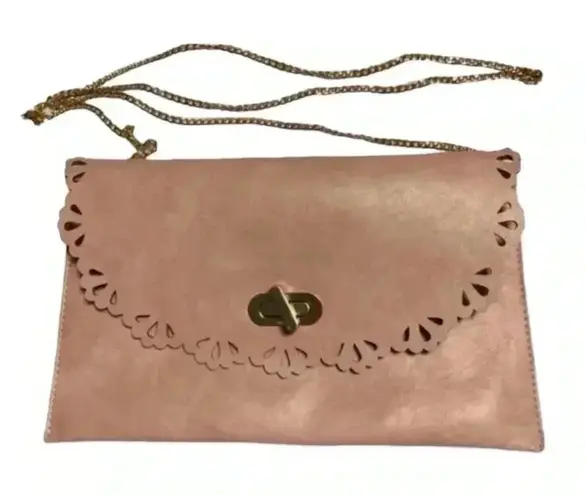 Moda Luxe blush pink leather clutch bag with intricate cut-out…