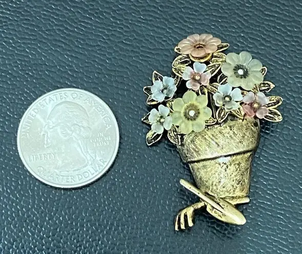 LIA Signed Pot of Flowers with Garden Tools Gold