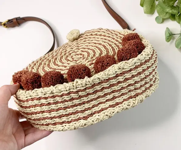 Fossil NWT Faye Baked Clay Woven Pom Pom Crossbody Bag Tan 55 37 Off Retail New With Tags From Carli