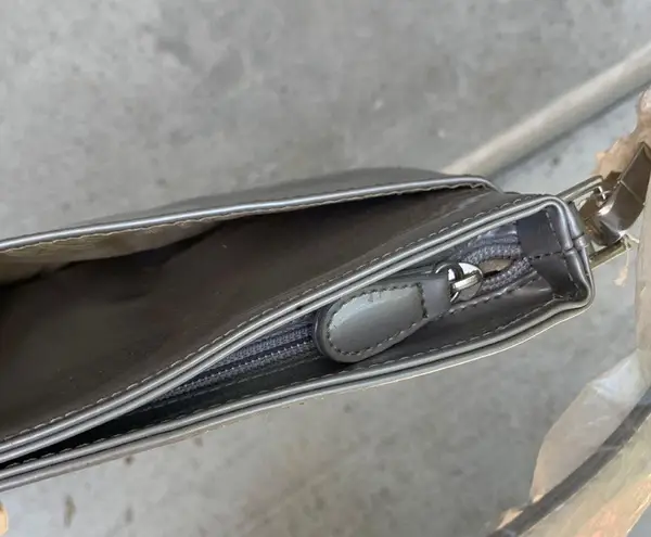 90s style purse Fits over the shoulder very cute silver color