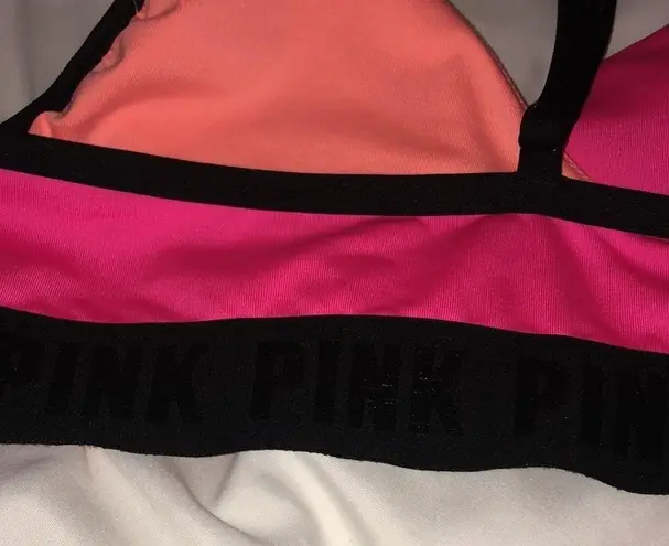 PINK - Victoria's Secret PINK Sport swim suit bikini top orange and pink in color size small spor…​