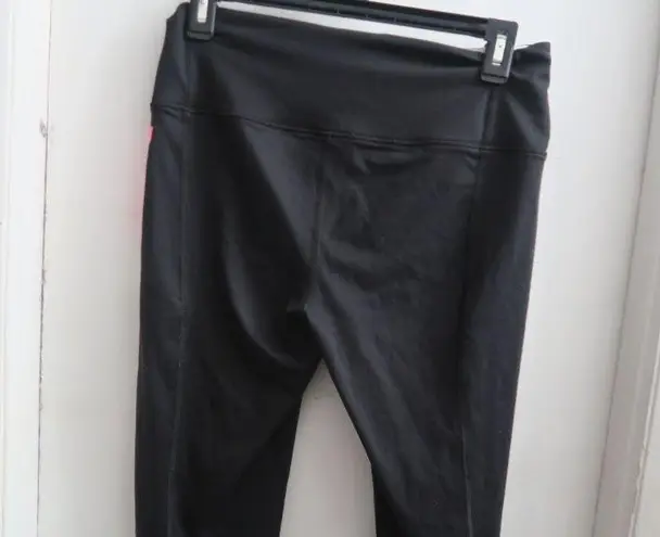 Victoria's Secret VSX sport knockout tight leggings in black, white and pink size medium.