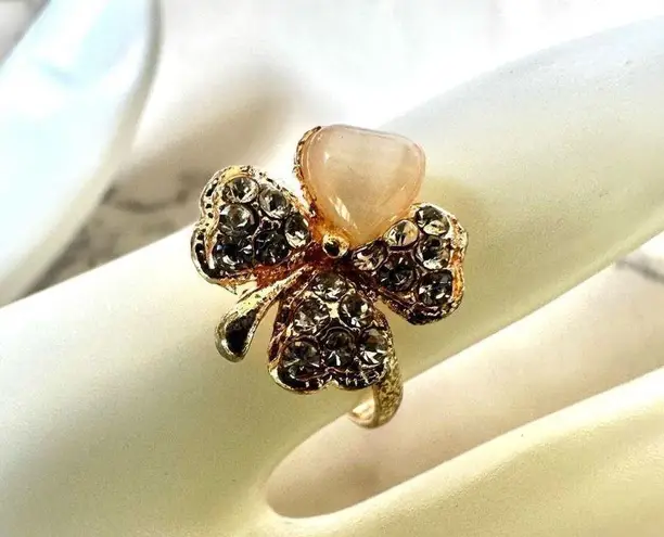 Gold tone rhinestone four leaf clover ring