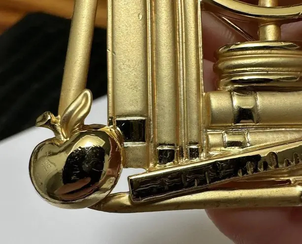 Signed AJC Gold Tone Earth Glove On A Stack Of Books Brooch Pin