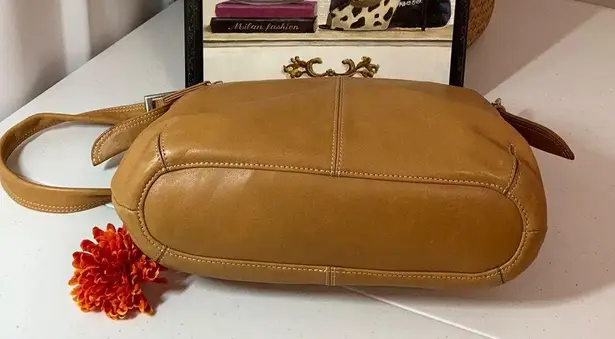 Tignanello genuine leather purse with many compartments.
