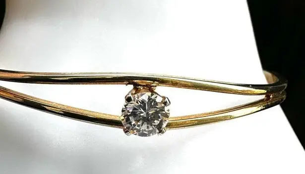 Gold tone open cuff rhinestone bracelet