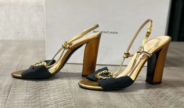 Balenciaga women’s gently used black and gold strappy sandals
