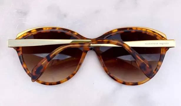 Alexander McQueen women’s AMQ 4241/S tortoise Havana gold cat-eye sunglasses