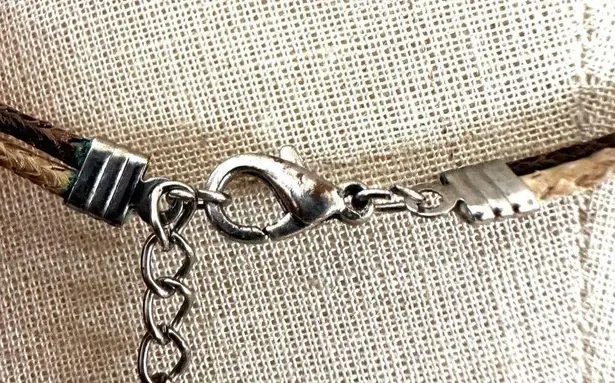 Gold tone rhinestone pendant necklace on cord