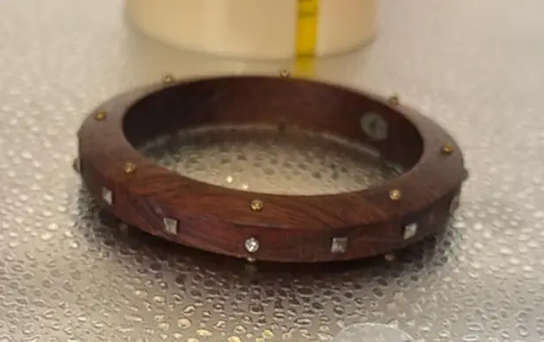 Silpada wooden bracelet with sparkle embellishments on the wood.