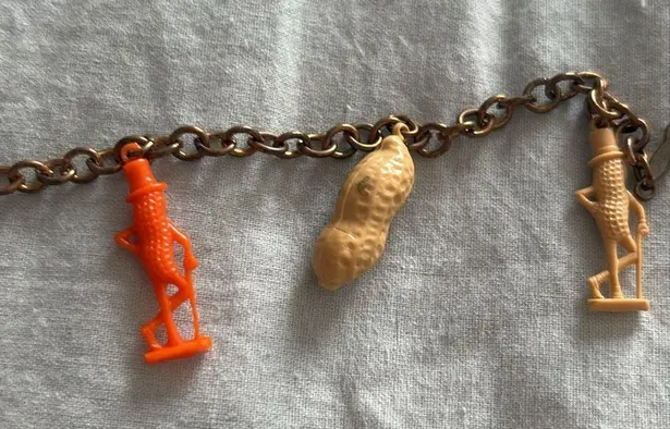 Vintage Advertising PLANTERS MR PEANUT Figural Plastic Charm Bracelet 7” Long Orange
