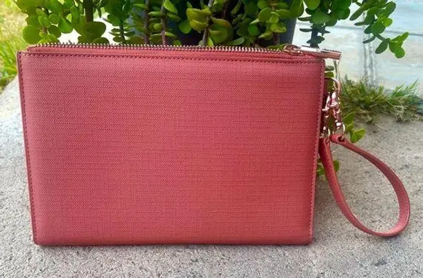 Dagne Dover pink wristlet clutch bag