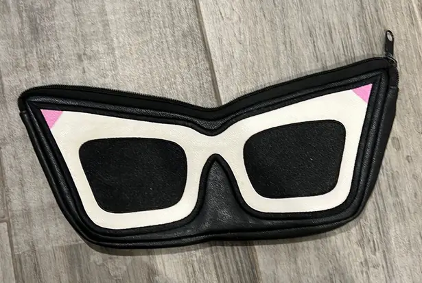 Cosmetic pouch in cat eye shape. Love Bravery by Lady Gaga and Elton John Black