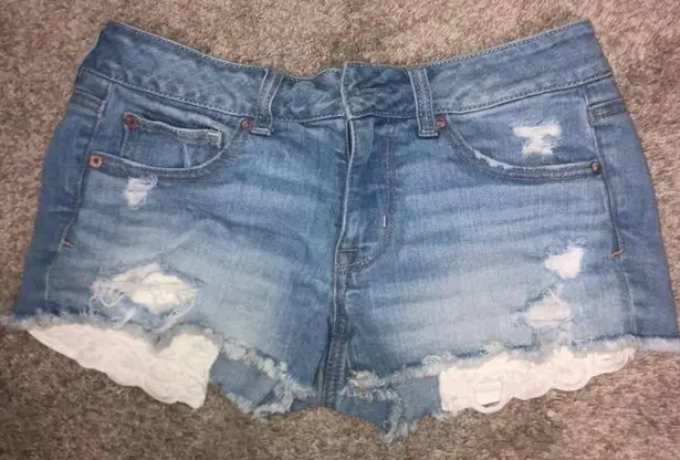 Distressed shorts with pockets showing sales