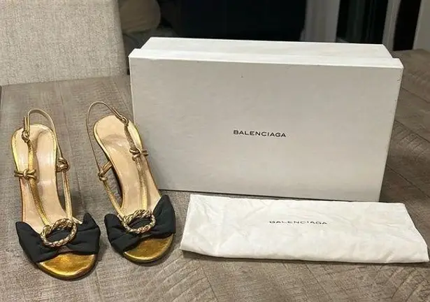Balenciaga women’s gently used black and gold strappy sandals