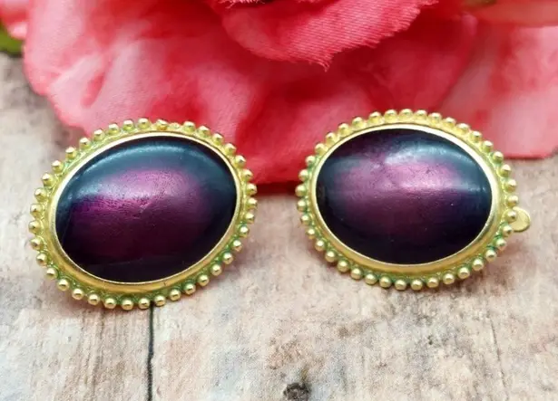 Trifari TM Gold Tone Oval Clip On Earrings Textured Trim Purple Plum Center 1"