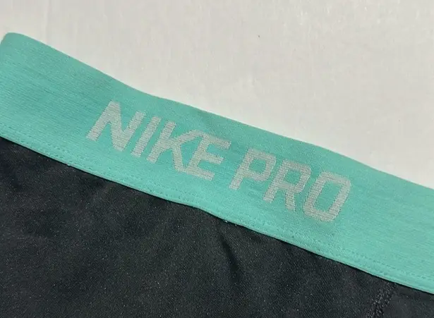 Nike  pro shirts Fri fit since large Tiffany blue and black