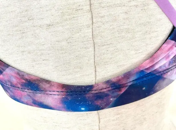 Onzie pink purple galaxy sports bra