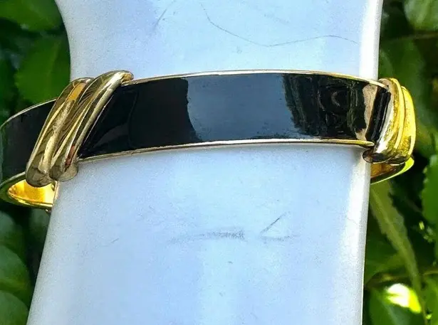 Monet  black and gold tone bangle bracelet