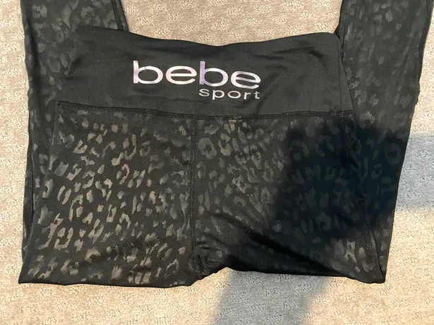 Bebe NWOT  Sport black animal print cropped leggings. Sz S