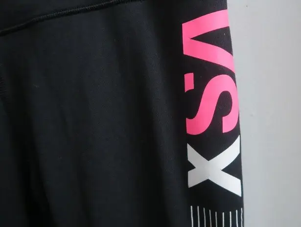 Victoria's Secret VSX sport knockout tight leggings in black, white and pink size medium.