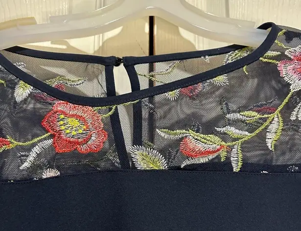 AGB navy dress with sheer floral details at neck and sleeves. Size 10